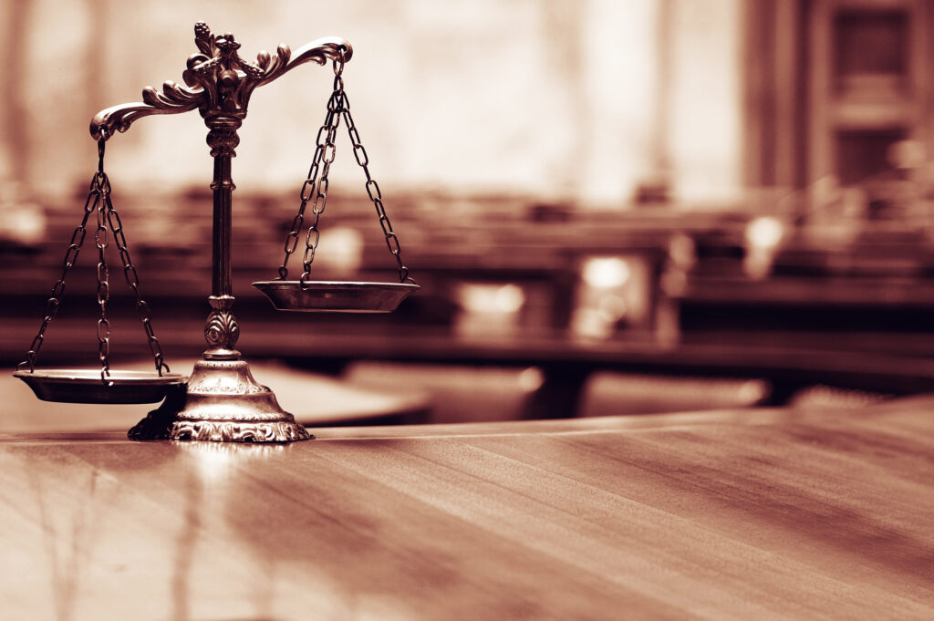 Scales of justice in an empty courtroom